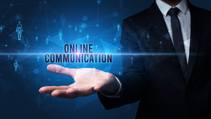 Elegant hand holding ONLINE COMMUNICATION inscription, social networking concept
