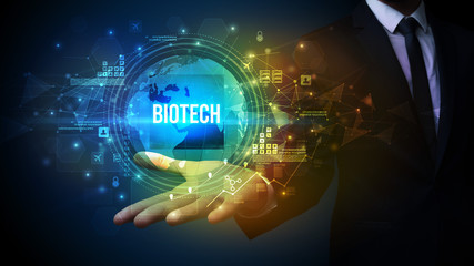 Elegant hand holding BIOTECH inscription, digital technology concept