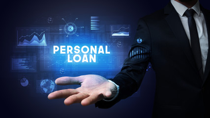 Hand of Businessman holding PERSONAL LOAN inscription, business success concept