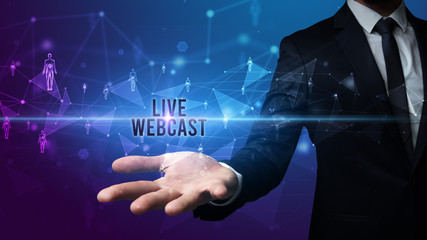 Elegant hand holding LIVE WEBCAST inscription, social networking concept