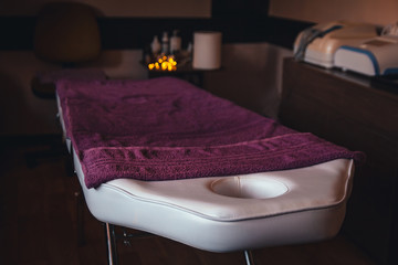 Place for relaxation in modern wellness and spa center with purple towels