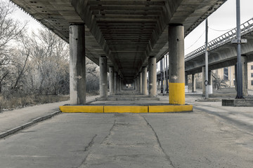Elevated highway on concrete columns.  Freeway over an industrial area
