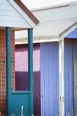 Abstract view of Beach huts. Sutton on Sea beach hut juxtaposition of colours and structure of huts. Various colours in vivid shades and brightness. Summertime holiday resort.