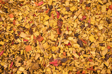 Texture of brightly painted wood shavings