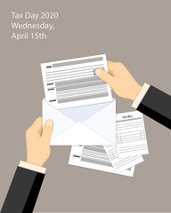 Businessman hands with envelope and form 1040 for tax day 2020