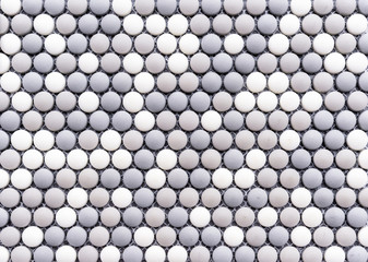 Ceramic mosaic tiles with gray and white circles.