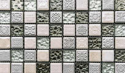 Ceramic mosaic tiles with beige and mint embossed squares to decorate the kitchen, bathroom or pool.