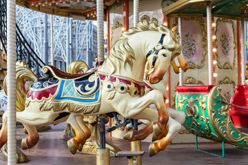 Fototapeta na wymiar Horse in vintage style on a children's circular carousel.