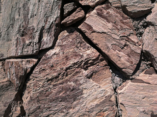 Stones stacked to a wall - structures as background