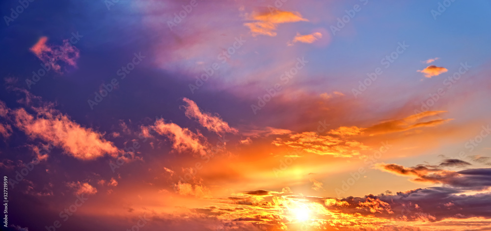 Wall mural sunset sky landscape background natural color of evening cloudscape panorama with setting sun rays c
