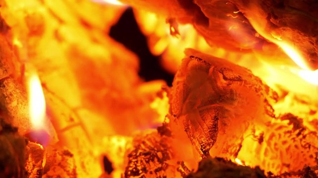 4K - Burning coals inside a campfire