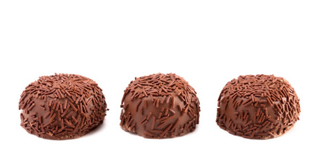 Three Milk Chocolate Truffles in a Row on a White Background