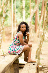 Portraits of a beautiful young black woman with beautiful curly hair. Brazilian