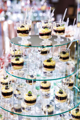 Festive table for newlyweds and guests. Dessert table for a wedding party