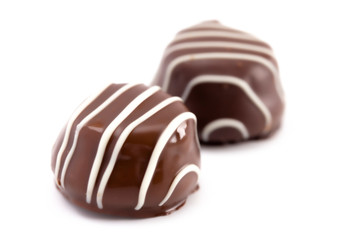 Pair of Chocolate Truffles Isolated on a White Background