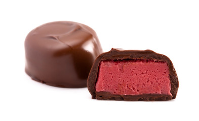 Chocolate Red Raspberry Truffle Cut Open and Isolated on a White Background