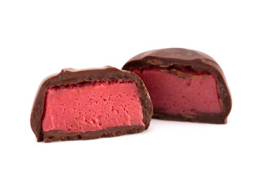 Chocolate Red Raspberry Truffle Cut Open and Isolated on a White Background