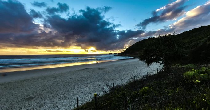 Time lapse impressions from Gold Coast Australia, Sunrise over the pacific ocean, motion control timelapse of fast moving clouds during sunrise at Gold Coast, Corindi Beach New South Wales. Panorama 