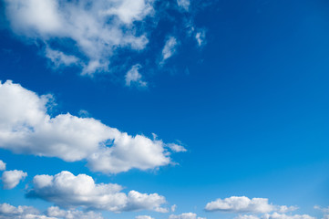 Naklejka na ściany i meble beautiful white clouds in bright blue sky on the nice day