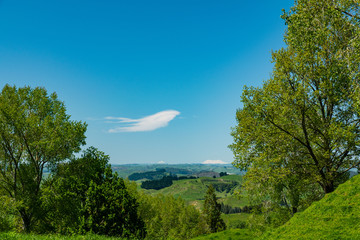 rural landscape with rolling hills and clouds