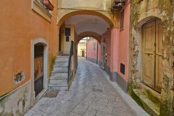 Fototapeta na wymiar Sant'Agata de 'Goti, Italy, 02/29/2020. A narrow street between old houses of a medieval village.