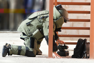 Engineer with EOD suit deactivates bomb