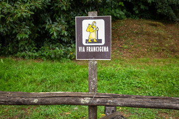 signpost of the Via Francigena (pilgrim's route to Rome) in the countryside