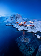 View on the house in the Hamnoy village, Lofoten Islands, Norway. Landscape in winter time during blue hour. Mountains and water. Travel - image