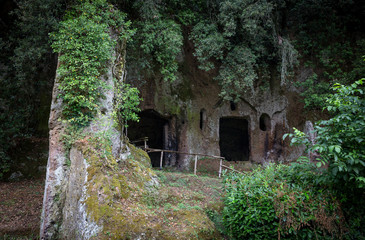 Etruscan necropolis with tombs hollowed out of red tuff rock in Sutri, province of Viterbo, Lazio, Italy