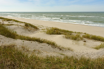 Fototapeta na wymiar Sand dunes. Sand dunes on the sea beach.