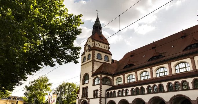 Leipzig, Germany - walking time lapse showing city zoo entrance and tram stop. A hyper lapse in front of the zoo of the city of leipzig, Saxony, Germany, Europe