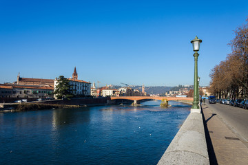 Fototapeta na wymiar View on the city of Verona from the Adige river that crosses it.