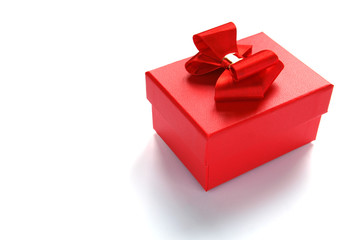 Gift box with red bow isolated on white background