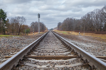 railway line. rails and concrete sleepers extending into the distance. travel by train.