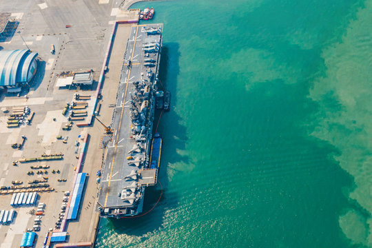 USS America. Navy Aircraft Carrier Aerial Top View Of Battleship, Military Sea Transport, Military Navy Rescue Helicopter On Board The Battleship Deck, Amphibious Assault Ship