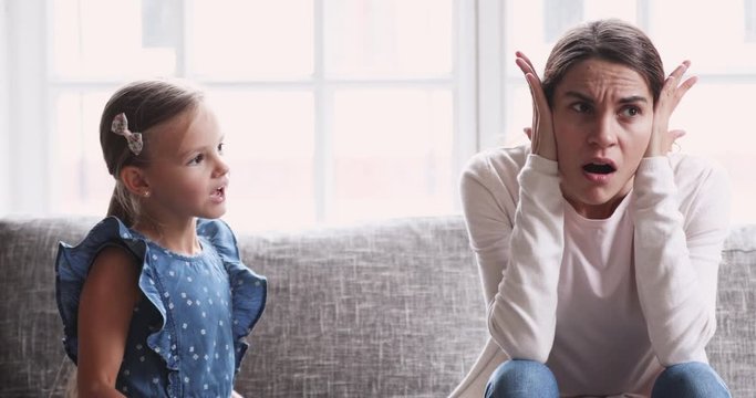 Tired single mother feel desperate about screaming kid daughter