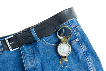 Trousers and a compass lie on a white background.