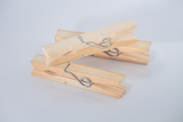 A clothespin or clothes peg is used to hang up clothes for drying, normally on a clothes line. Clothespins often come in many colors and different designs. Can be in plastic or wooden