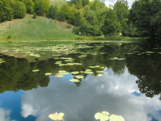 The lake reflects the surrounding landscape like a mirror