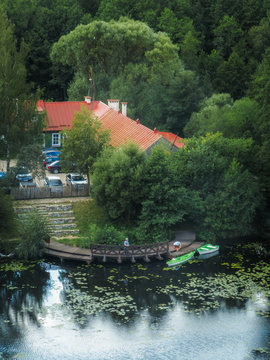 View from the hill to the forest, lake and house