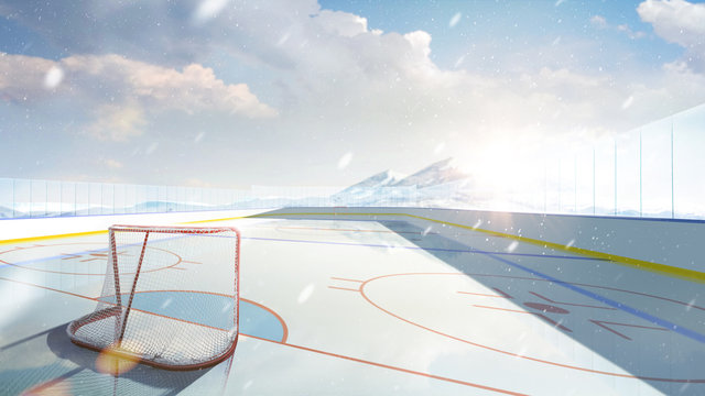 Hockey arena. An outdoor hockey rink is lit by the sun. Hockey in the mountains. Empty sports ice rink. Snowfall in the mountains. Wide angle