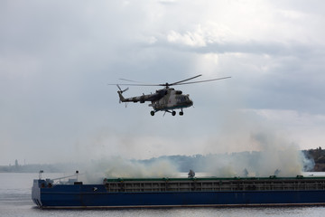 A military helicopter picks up a soldier
