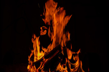flame, burning wood giving heat and light