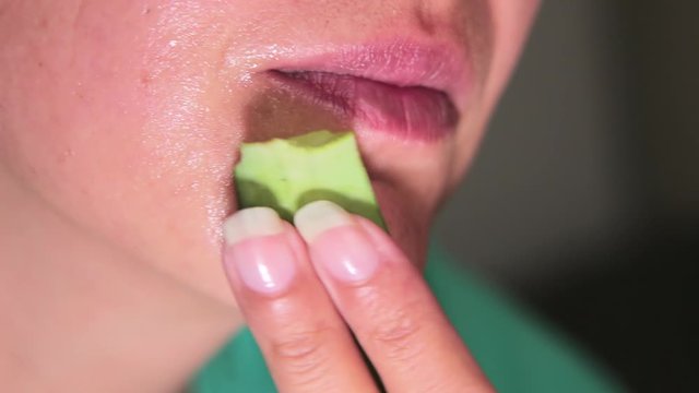 Young woman puts aloe vera gel on her face. Using a fresh aloe vera gel for the face. Aloe Vera gel care
