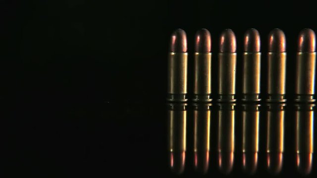 Bullets in a row. Group of bullets on the table slider shoot. Bullets isolated