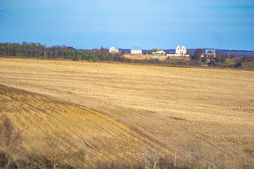 Plowed field in autumn day