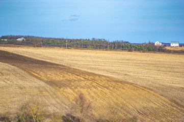 Fototapeta na wymiar Plowed field in autumn day