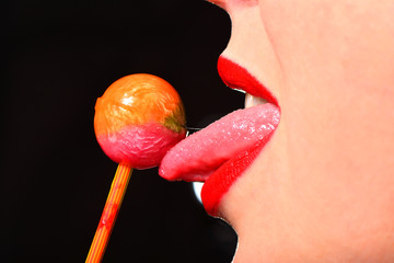 Girl sexually licks tongue out a lollipop