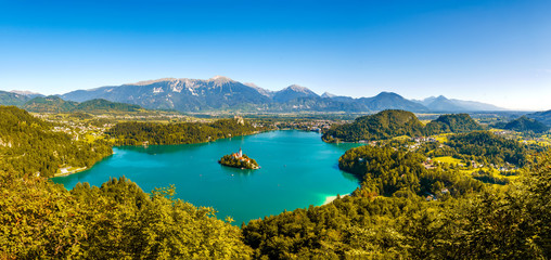 Naklejka na ściany i meble Aerial panoramic view on the Pilgrimage Church of the Assumption of Maria on the Lake Bled