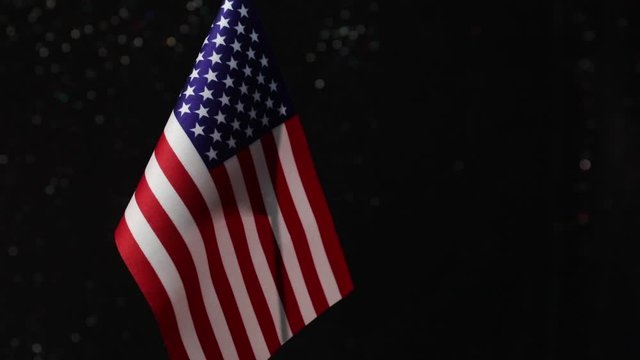 Closeup, flags on dark background. Concept of crisis of war and political conflicts between nations. Selective focus